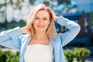 55-year-old woman enjoys time in the sun with good skin thanks to cosmetic laser treatments