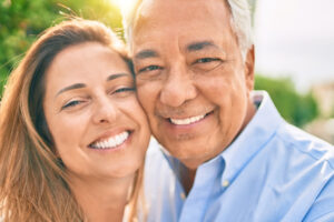 Older Hispanic couple has healthy skin after Mohs surgery recoveyr.